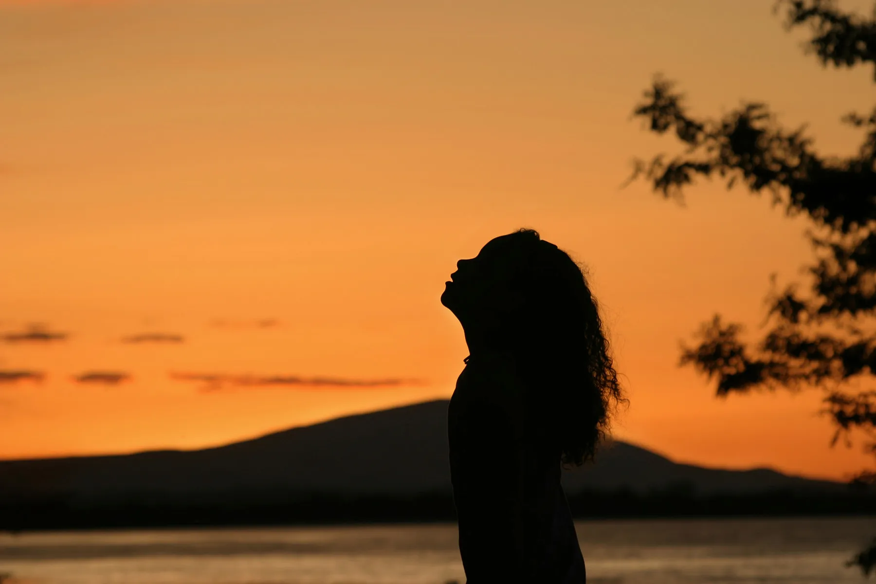 photo of woman outside at sunset