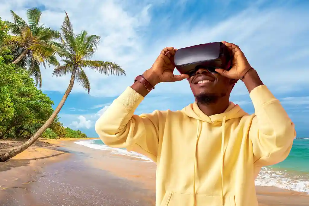 photo of man experiencing beach with VR headset