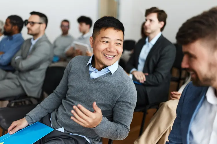 photo of happy businessman during lecture break