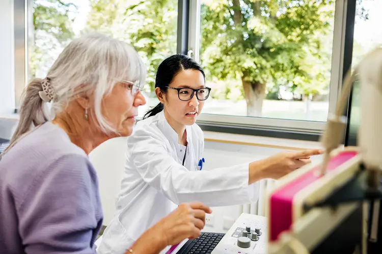 photo of doctor reviewing test results with senior patient