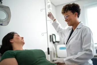 photo of doctor starting IV drip for patient