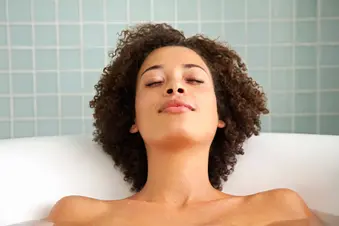 photo of woman taking bath