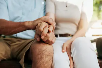 photo of couple holding hands