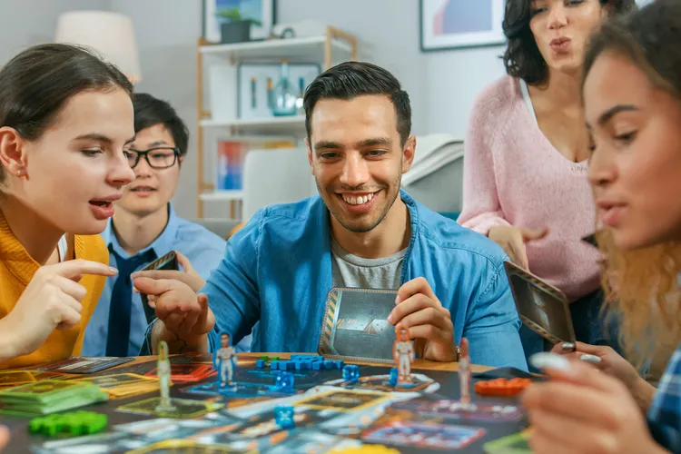 photo of friends playing board game