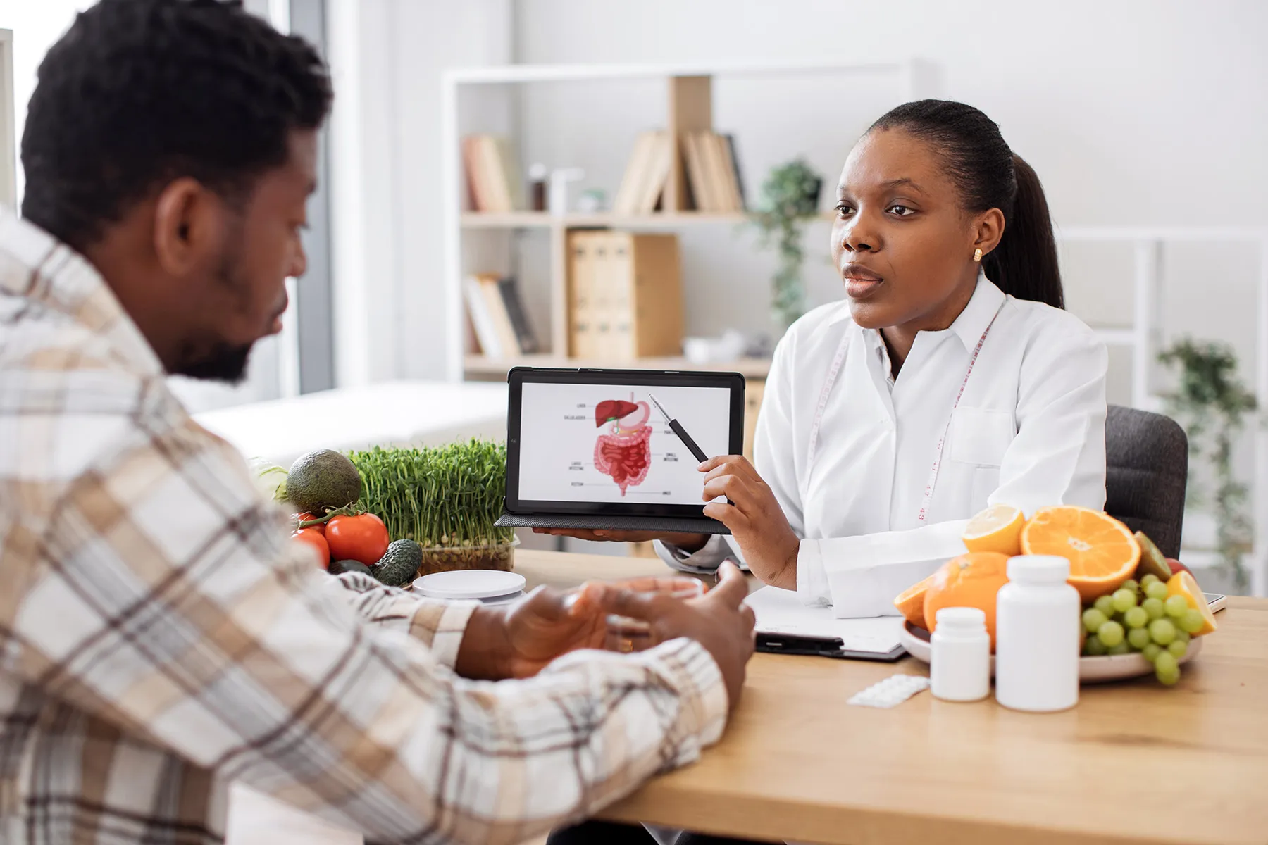 photo of dietitian counseling male patient