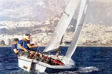 Bill Buckles, pictured here in the yellow hat, continues to sail. 