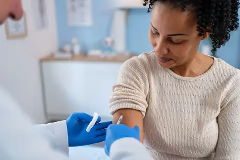 photo of woman getting vaccination