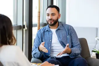 photo of young man in talk therapy session
