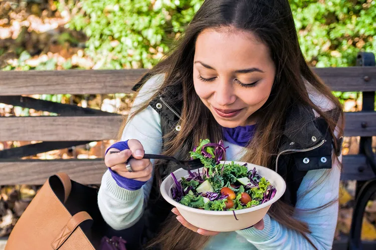photo of woman eating healthy salad