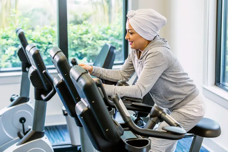 photo of woman on stationary bicycle