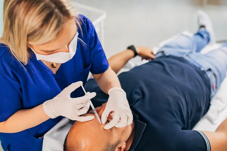 photo of man receiving injections in forehead