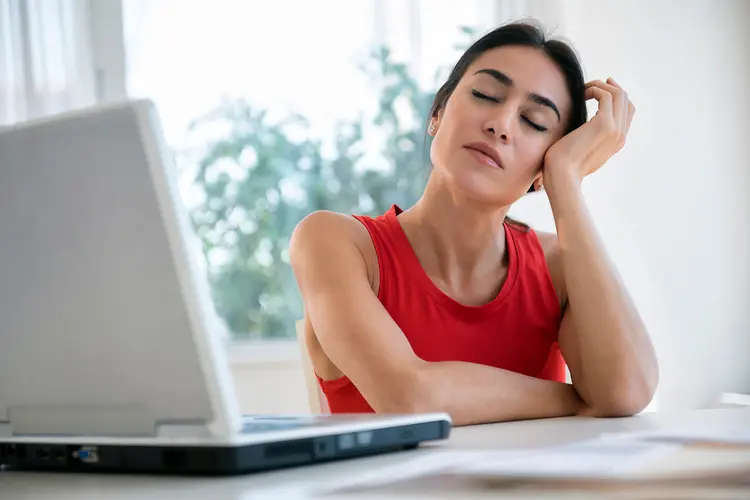 photo of stressed businesswoman at desk