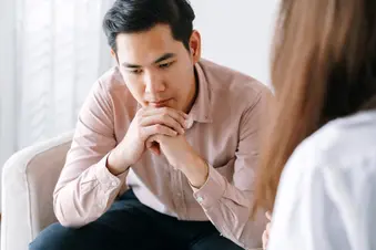 photo of young man in psychotherapy session