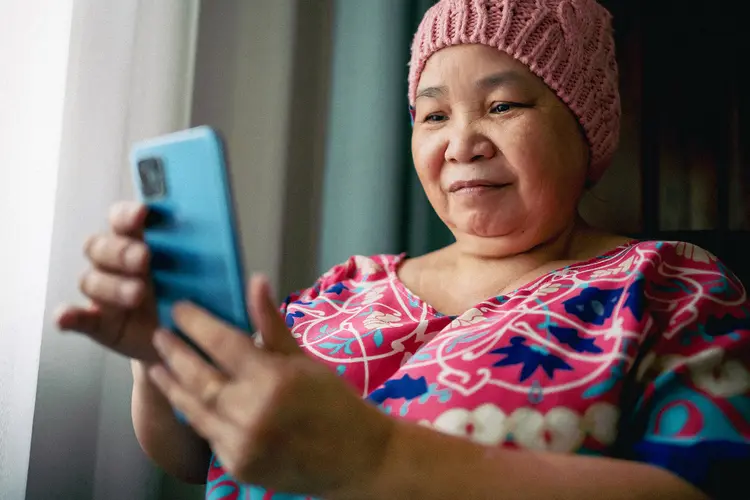 photo of senior woman using smartphone