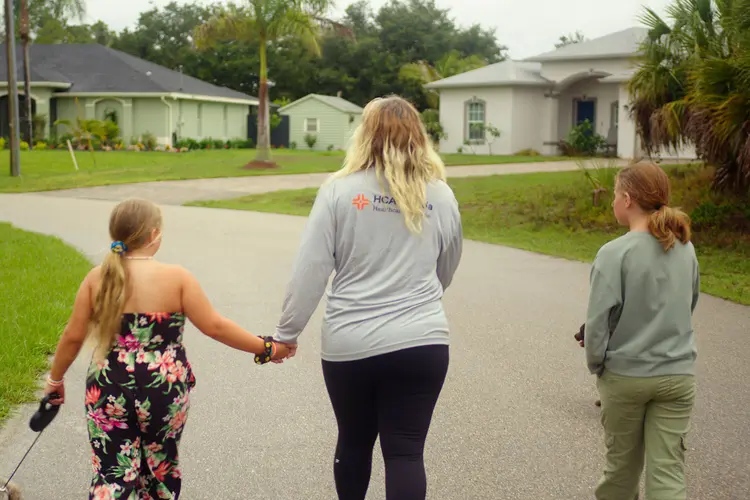 photo of Kimberly Cansler walking with kids