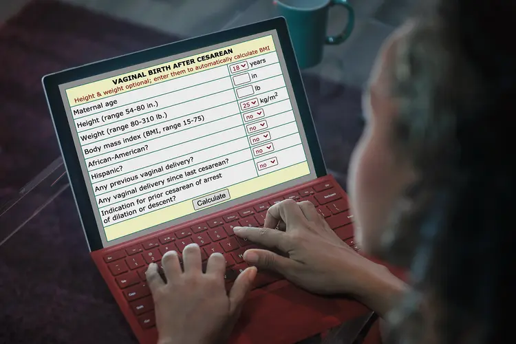 photo of woman using vbac calculator on laptop