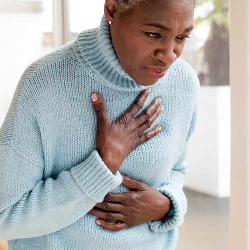 photo of woman experiencing heartburn