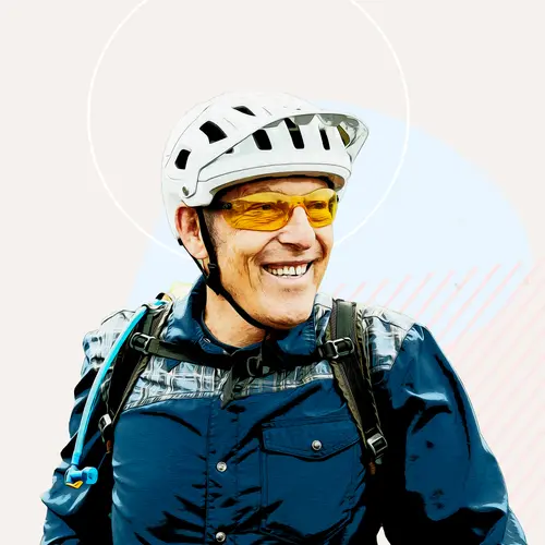 photo of man smiling with helmet