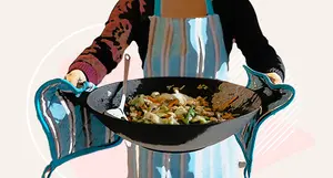 photo of holding large stir-fry wok
