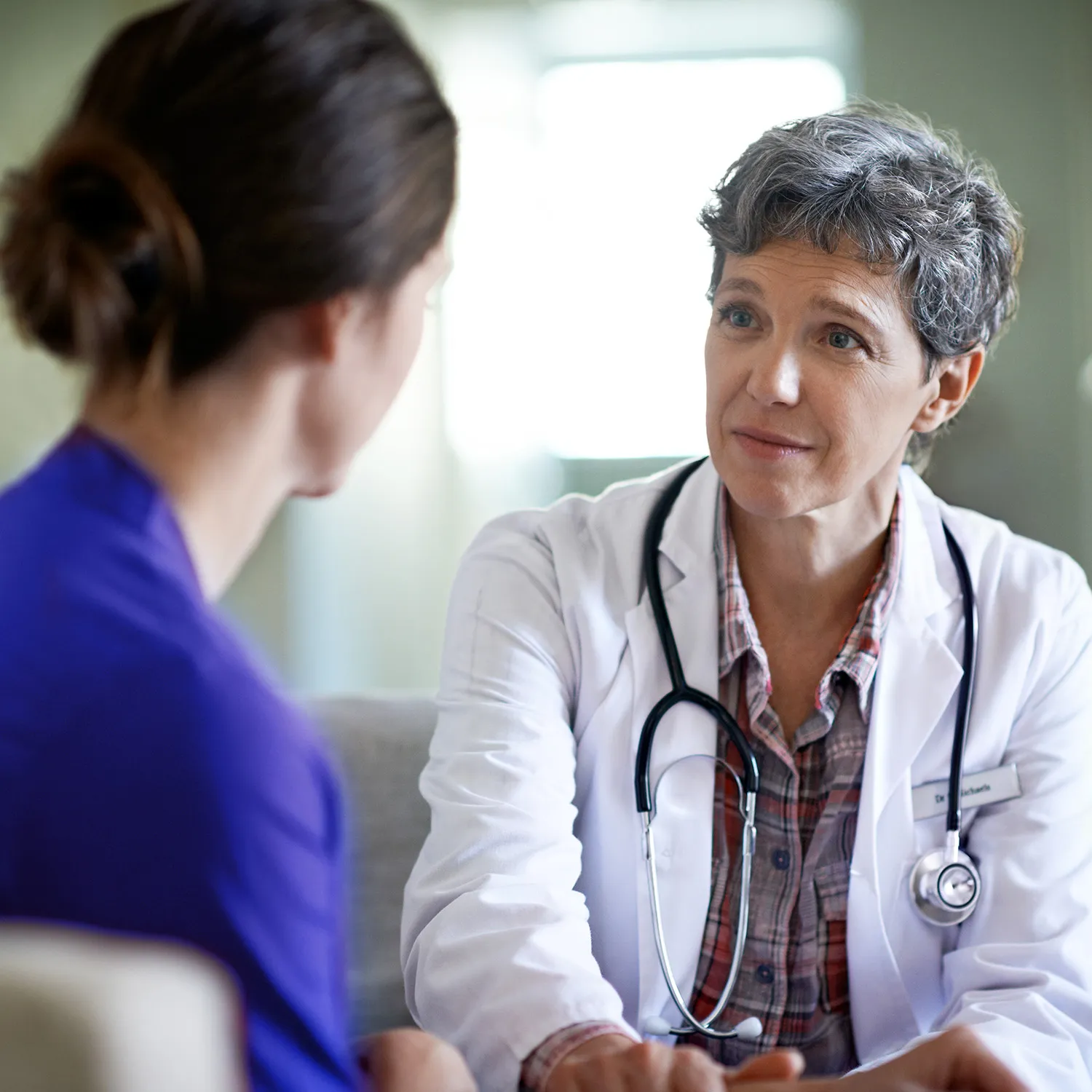 photo of woman and doctor