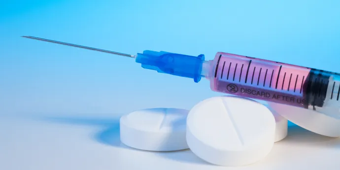 photo of syringe and pills