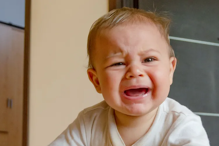 photo of Six month old baby boy crying.