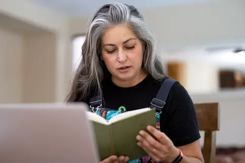 photo of woman in online learning program