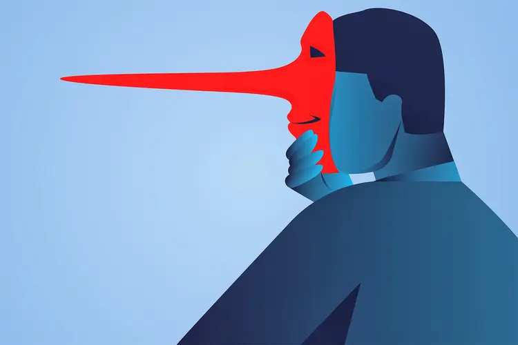 photo of Businessman wearing the mask of lies