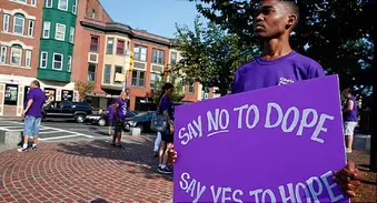 man holding sign