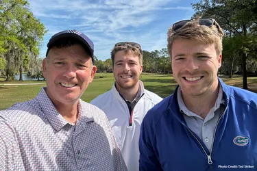 Ted Spiker, left, can now play golf with his twin sons. 