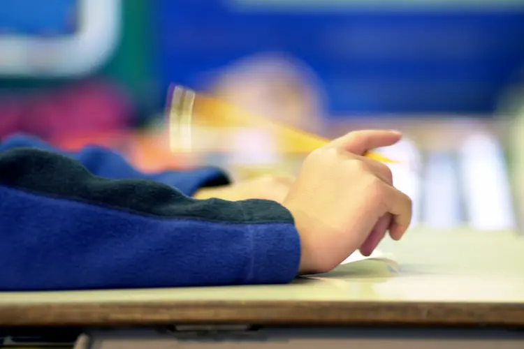 photo of hands flicking pencil