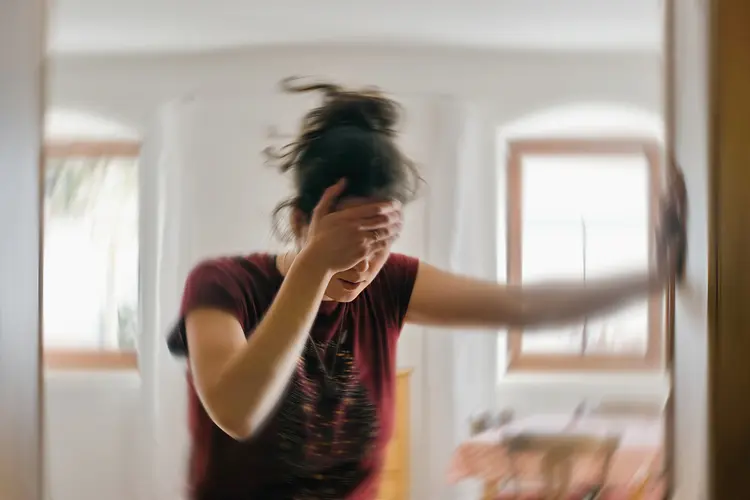 Photo of woman feeling dizzy