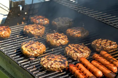 photo of food burgers on grill outside