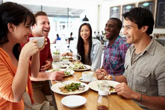 photo of friends eating in restaurant