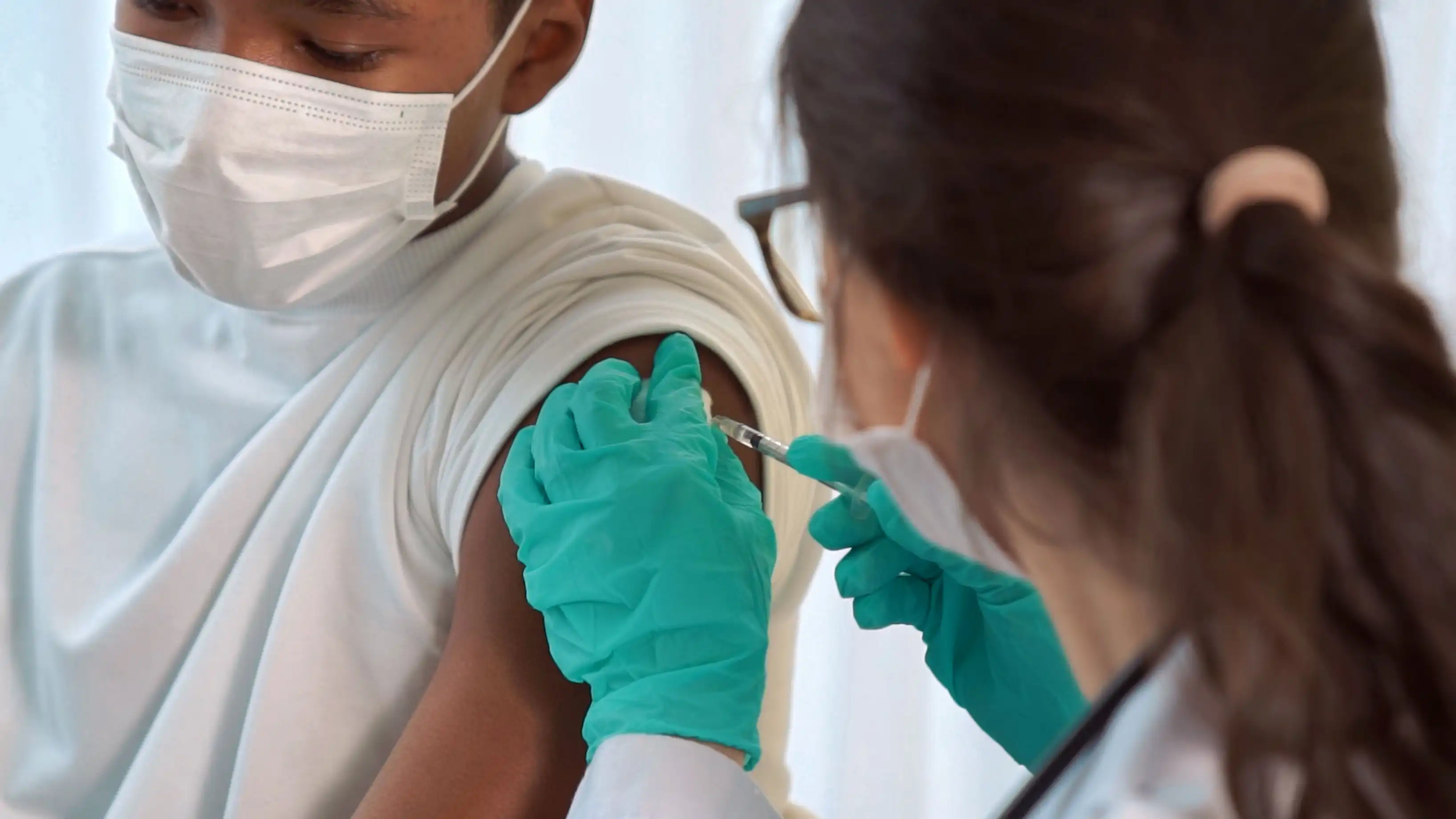 photo of boy receiving vaccination
