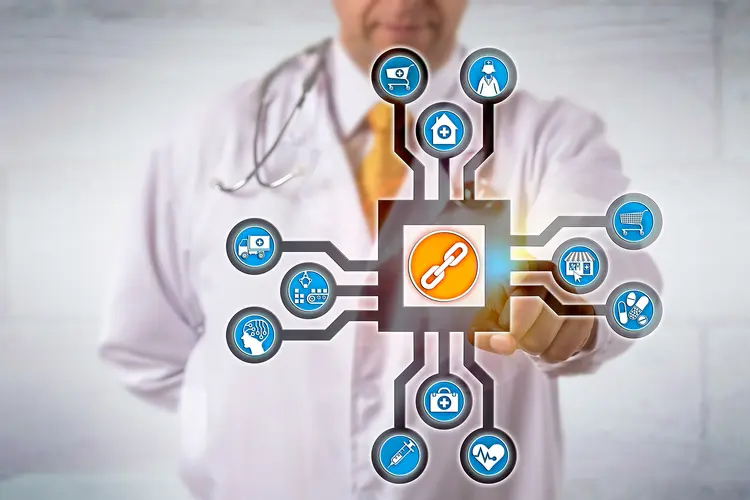 photo of doctor activates blockchain app concept