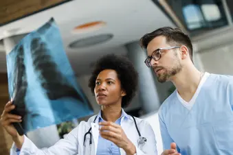 photo of doctors reviewing lung x-ray