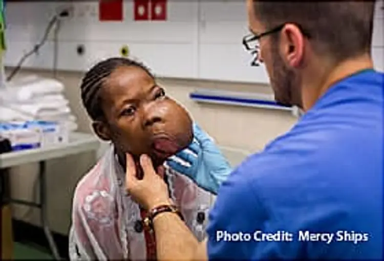 dr mark shrime examining patient