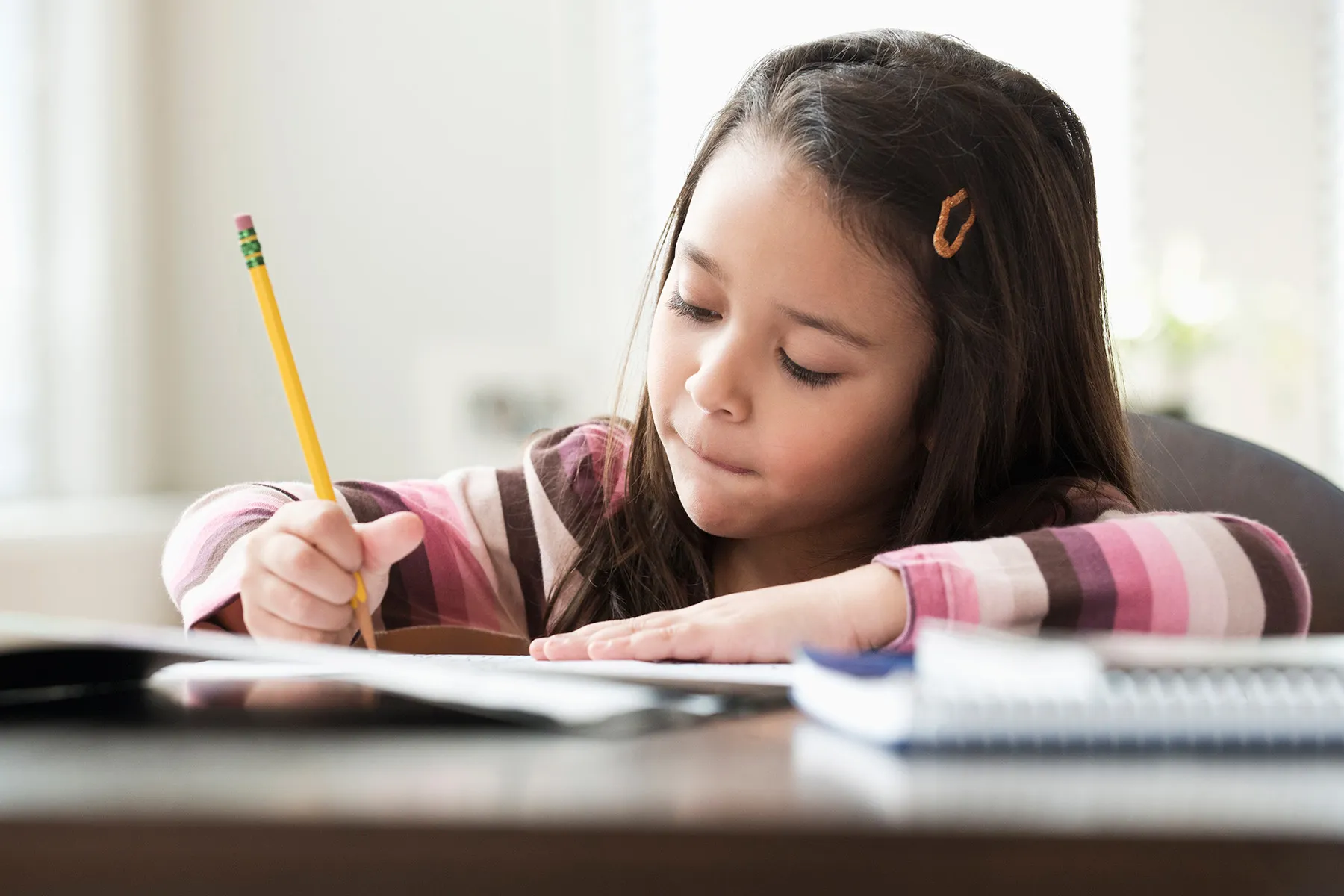 photo of girl doing homework