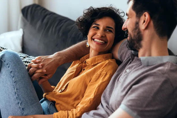 photo of Hispanic couple on couch