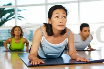 mature woman in yoga class