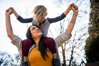 photo of mother playing with young son