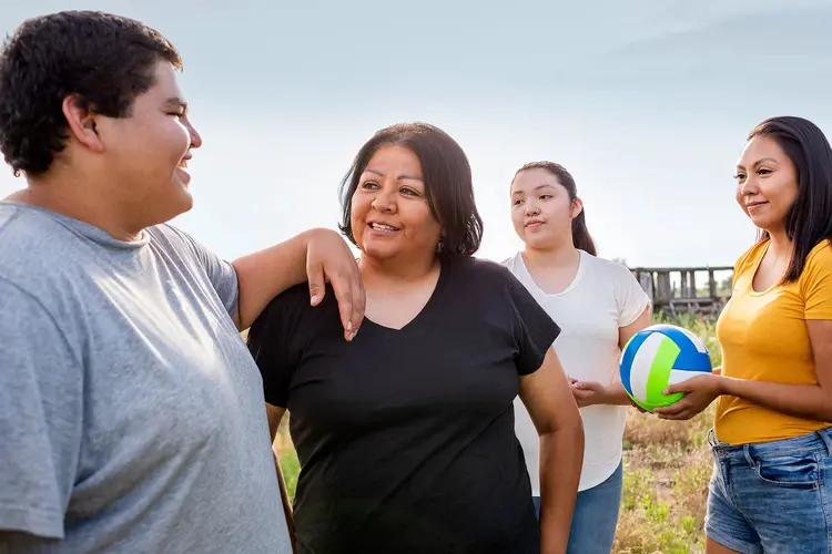 photo of mother with three teenage children