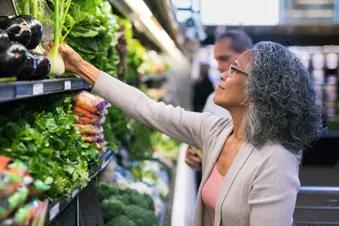 photo of senior couple shopping for vegetables