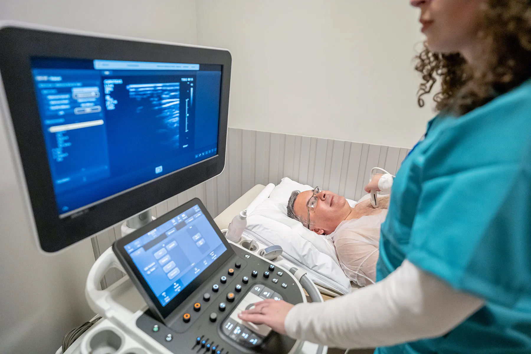 photo of senior man getting echocardiogram