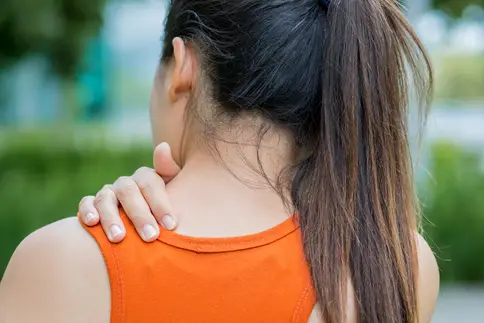 photo of woman with upper back pain