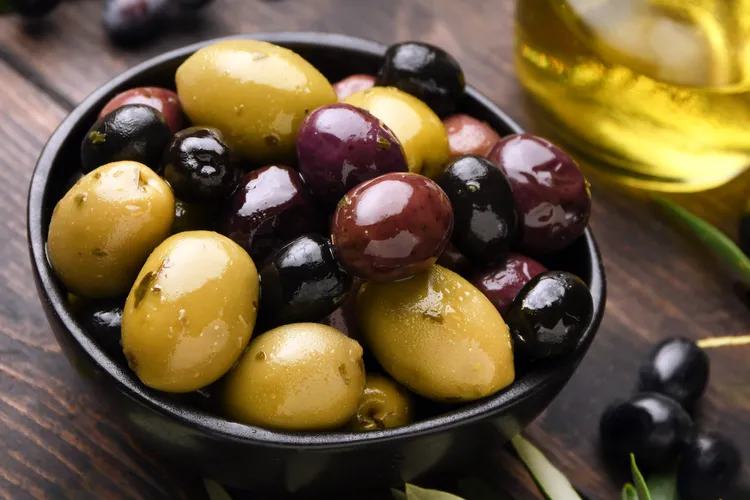 photo of variety of olives and olive oil