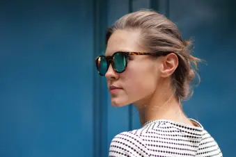 photo of woman wearing sunglasses indoors