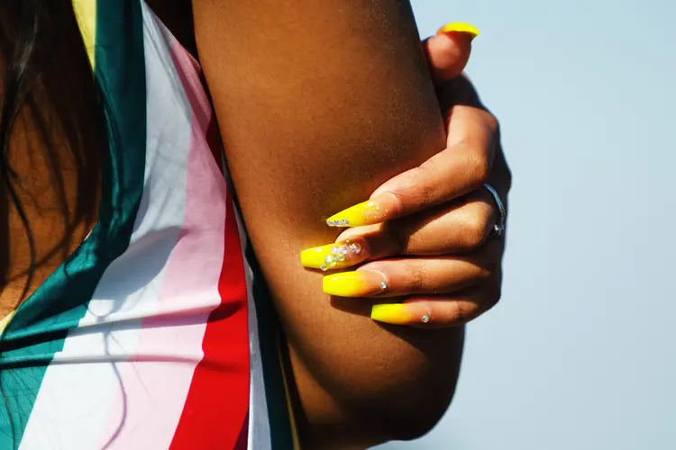 photo of woman with acrylic nails