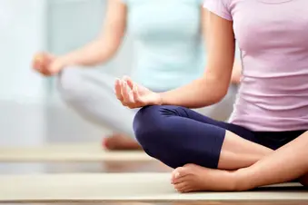 photo of lotus position in yoga class